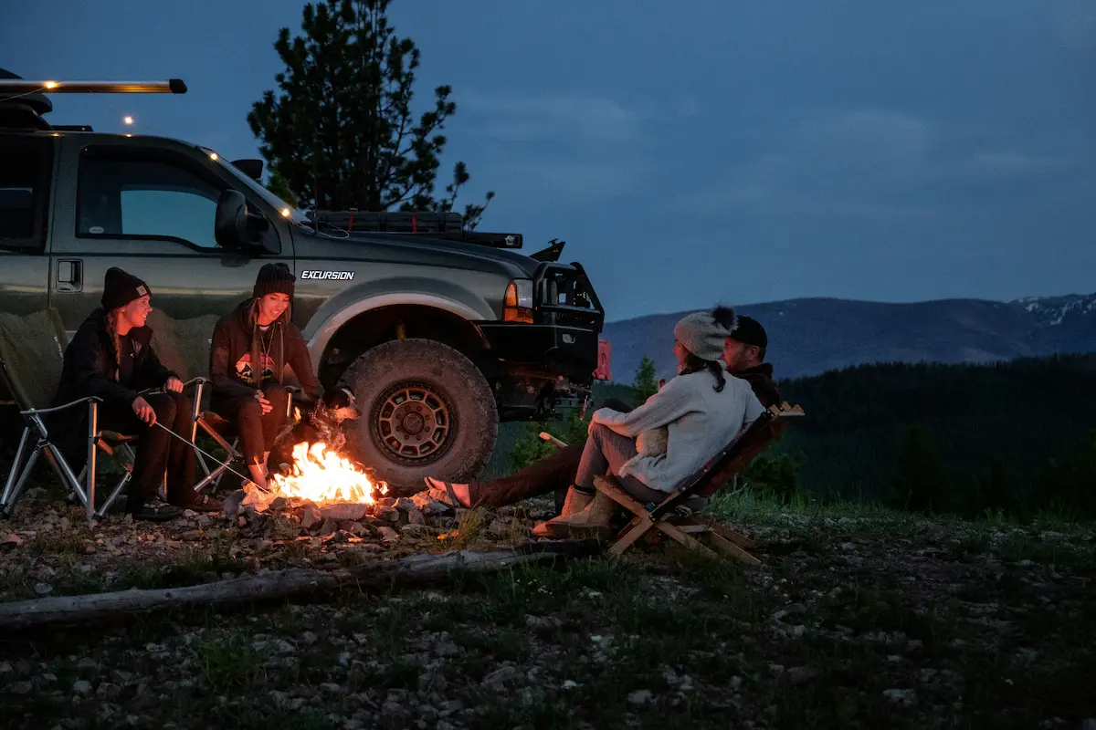 A group gathered around a campfire at Mountain Springs